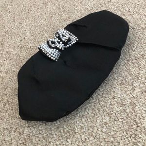 Pacomena black clutch with beaded bow